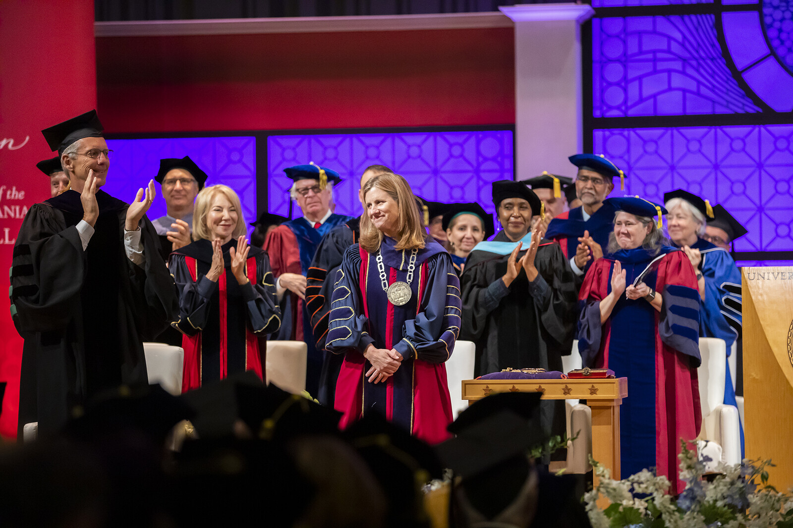 Board Chair Scott Bok, former President Gutmann, Deans of the 12 schools and other academic dignitaries applaud as President Magill is officially announced as Penn's 9th president