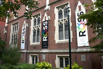Exterior of the Arthur Ross Gallery with brightly colored banners